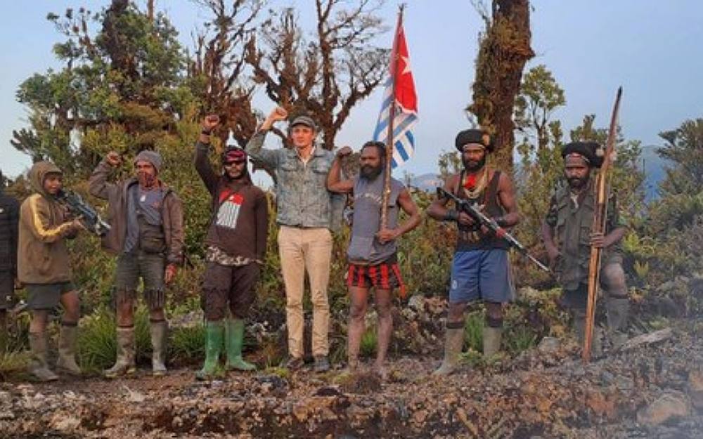 Separatist rebels in Indonesia’s Papua said Tuesday that a foreign pilot taken hostage last week was alive and well, as they released undated photographs and videos they said showed the New Zealand citizen, amid a group of apparent insurgents, in what appeared to be a forested area.